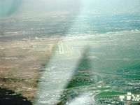 Albuquerque International Sunport Airport (ABQ) - Rainy descent to Rwy 26 in N2111Q Beech BONANZA 36 - by Doug Robertson