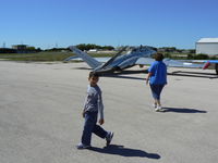 Lago Vista Tx - Rusty Allen Airport (RYW) - Mr Dill and a freind looking at the Jets - Lago Vista Airport - by Zane Adams