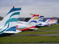 Panshanger Airport, Hertford, England United Kingdom (EGLG) - Colourful tails of the East Herts Flying School - by chris hall