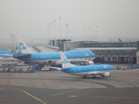 Amsterdam Schiphol Airport, Haarlemmermeer, near Amsterdam Netherlands (EHAM) - A foggy morning at Schiphol - by Henk Geerlings