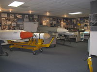 Point Mugu Nas (naval Base Ventura Co) Airport (NTD) - Command History Storage Facility, aka Point Mugu Missile Museum. Phoenix missile-gray white in center - by Doug Robertson