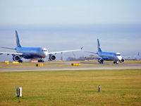 Manchester Airport, Manchester, England United Kingdom (EGCC) - N271AY and OH-OKG - by Chris Hall