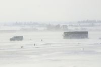 The Eastern Iowa Airport (CID) - Something you don't see everyday; safety escorts the U of I football team on taxiway A enroute to the plane. - by Glenn E. Chatfield