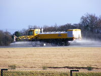Manchester Airport, Manchester, England United Kingdom (EGCC) - Spraying deicer on the runway  - by chris hall