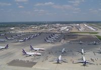 Memphis International Airport (MEM) - Amazing sight of part of the extensive Fedex ramp containing over 100 aircraft (A300-600,A310,MD11,DC10,B727 and ATR42), taken whilst on approach to 18R. Later that Afternoon a mass departure of 80 of these aircraft left in just 90 minutes, also visible i - by keith sowter