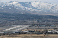 Reno/tahoe International Airport (RNO) - Reno-Tahoe International's runway 25-7 intersects with parallel runways 16L-34R and 16R-34L in this photo taken from the Virginia Range mountains east of the airport. - by Gary Schenauer
