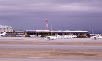 San Carlos Airport (SQL) - Panorama 1 of 4. SkyKitchenCafe on left of ad bldg. - by Bill Larkins