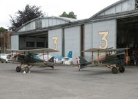 Old Sarum Airfield Airport, Salisbury, England United Kingdom (EGLS) - TWO REPLICA WW I SE5A'S IN FRONT OF GENUINE WW I BELFAST HANGERS - by BIKE PILOT