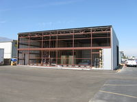 Santa Paula Airport (SZP) - New hangar under construction. Insulated, internal wall studs, framing for two-story rooms in corner - by Doug Robertson