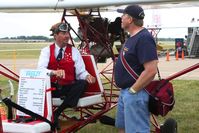 Wittman Regional Airport (OSH) - Breezy inventor Carl Unger giving building tips to Bob Simmermon. - by Bob Simmermon