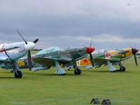 Duxford Airport, Cambridge, England United Kingdom (EGSU) - Beautiful line of Yak-fighters waiting for the action at the Legends 2009 - by Alex Smit
