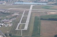 Findlay Airport (FDY) - Looking east at the construction work.  Note the illuminated X on RWY 7 - by Bob Simmermon