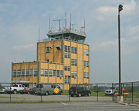 Morristown Municipal Airport (MMU) - The control tower is original; the rest of this once quiet airport is surrounded by a panopoly of operators of private jets. - by Daniel L. Berek