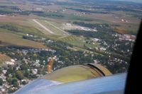 Grimes Field Airport (I74) - Approaching from the south in B17 N3139G during the MERFI event. - by Bob Simmermon