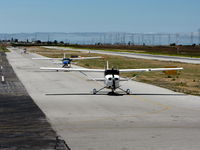 Palo Alto Arpt Of Santa Clara Co Airport (PAO) - Looking like a Mini-LAX with four Cessna 172/182 taxiing for take-off - by Steve Nation