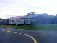 Welshpool Airport - looking back at the main hangar at Welshpool with the old tower on top - by Chris Hall