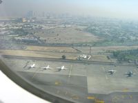 Dubai International Airport, Dubai United Arab Emirates (OMDB) - Taking off from Dubäi Airport. Can see Dubai in the background. - by Erdinç Toklu