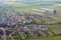 CARDINGTON Airport - RAF Cardington, UK (Closed), taken during a flight in Airship Industries Skyship 600 G-SKSC. The historic airship sheds in the background. - by Malcolm Clarke