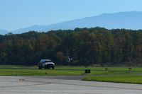 Gatlinburg-pigeon Forge Airport (GKT) - Helicopter activity and the fuel truck. - by Bob Simmermon