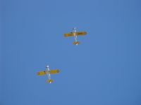 Santa Paula Airport (SZP) - Two Ryan ST-3KRs as PT-22s, N58651 #38 and N53271 #596 (in lead) overhead formation with wonderful 5 cylinder Kinner radial rumbles. - by Doug Robertson
