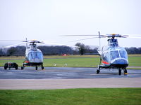 RAF Shawbury Airport, Shawbury, England United Kingdom (EGOS) - ZR324 and ZR325 Agusta A-109E's of the Defence Helicopter Flying School - by Chris Hall
