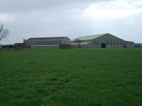 Pembrey Airport, Pembrey, Wales United Kingdom (EGFP) - The remaining two former F Type sheds used for agricultural purposes.  Located on the former RAF Station Pembrey airfield technical site. - by Roger Winser