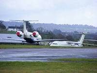 Exeter International Airport, Exeter, England United Kingdom (EGTE) - Embraer ERJ-145 and BAe 146 in storage at Exeter Airport - by Chris Hall
