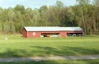 Old Rhinebeck Airport (NY94) - the red hangar across the field - by Ingo Warnecke