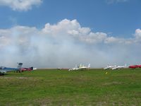 Zephyrhills Municipal Airport (ZPH) - Transient activity and someone laying down a little smoke during Sun N Fun week - by Bob Simmermon