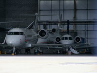 London Luton Airport, London, England United Kingdom (EGGW) - Biz jets inside the Signature Flight Support hangar - by Chris Hall