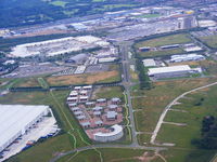 Liverpool John Lennon Airport - The original Liverpool Airport at Speke, the old terminal building and apron can be seen to the left of the picture - by Chris Hall