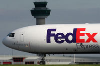 London Stansted Airport - Fed Ex MD11 passing Stansted's tower - by N-A-S