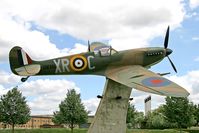 RAF Lakenheath - Supermarine 349 Spitfire F5 (replica) BM361 / XR-C in the commemorative area at RAF Lakenheath. Painted in the colours of 71 Eagle Sqn, a touching tribute to Fighter Command from the USAF's 48th Fighter Wing. - by Malcolm Clarke