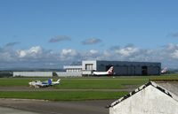 Cardiff International Airport, Cardiff, Wales United Kingdom (EGFF) - View towards BAMC hangar. - by Roger Winser