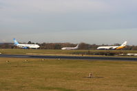 Manchester Airport, Manchester, England United Kingdom (EGCC) - Thomas Cook A330 lined up ready for departure as BMI Baby B737 and Monarch B767 hold - by Chris Hall