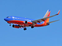 Mc Carran International Airport (LAS) - Southwest Airlines / Looks like a running back - ball tucked in arm extended to push away a tackler. - by SkyNevada