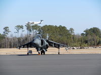 Wilmington International Airport (ILM) - A Marine Harrier sits on the tarmac of ILM waiting to be refuled as normal air traffic continues around it. - by Mlands87
