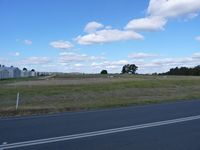 Kyneton Airport, Kyneton, Victoria Australia (YKTN) - Kyneton Airfield Hangars and grass strip looking east. - by red750
