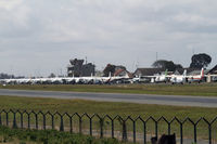 Arusha Airport - Crowded ramp at Arusha. Mainly Cessna 208 - by Duncan Kirk