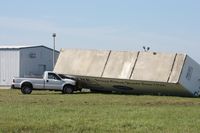 Lakeland Linder Regional Airport (LAL) - Storm damage from the 3/30/11 microburst/tornado.  Trailer blown down onto a Ford F250 - by Florida Metal