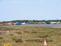 Blackbushe Airport, Camberley, England United Kingdom (EGLK) - view across the GA parking area - by Chris Hall