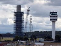 Melbourne International Airport, Tullamarine, Victoria Australia (YMML) - Old and new control towers at Tullamarine. The new one is required because the old one has concrete rot caused by using inferior concrete in its construction. - by red750