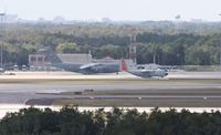 Orlando International Airport (MCO) - LC-130 and C-17 on west ramp - by Florida Metal