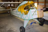 Parr Airport (42I) - Airport owner Chuck Norman showed us his Cub restoration while at the EAA fly-in. - by Bob Simmermon