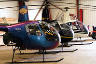 Wellesbourne Mountford Airfield - R22's in the Heli Air hangar at Wellesbourne Mountford.
From front to rear, G-ZAPY, G-OSAZ and G-JHEW - by Chris Hall