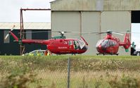 Swansea Airport, Swansea, Wales United Kingdom (EGFH) - Two Wales Air Ambulance helicopters at the air ambulance base. - by Roger Winser