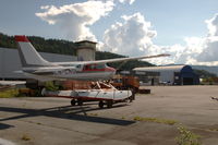 Notodden Airport, Tuven, - Overview of the platform and hangars with Cessna U206E floatplane LN-LMQ. - by Henk van Capelle