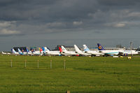 Dublin International Airport - Part of the line-up of charter flights that brought Portuguese supporters to Dublin for the EUFA cup final. - by Noel Kearney