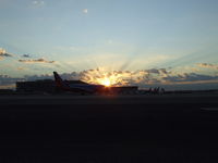 Phoenix Sky Harbor International Airport (PHX) - Sunrise through the cockpit of a Southwest Airliner - by Sgt_Eagar