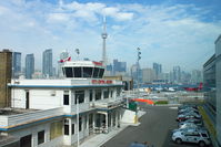 Toronto City Centre Airport - Nice to see that amongst all the new developments at Toronto City Centre Airport that the old Terminal has been retained , even if dwarfed by the new buildings - by Terry Fletcher